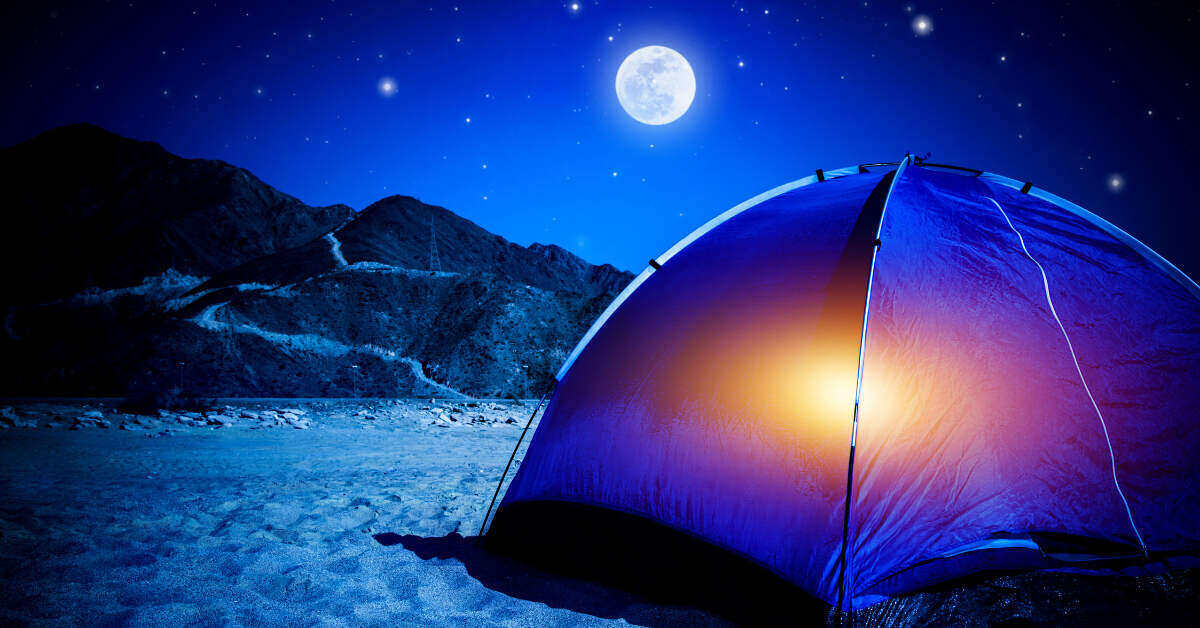 Camping tent with full moon in the background